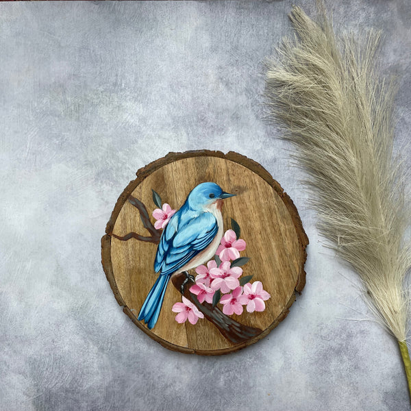 Blossom Whisper – Handpainted Bluebird on Wooden Log with Cherry Blossoms