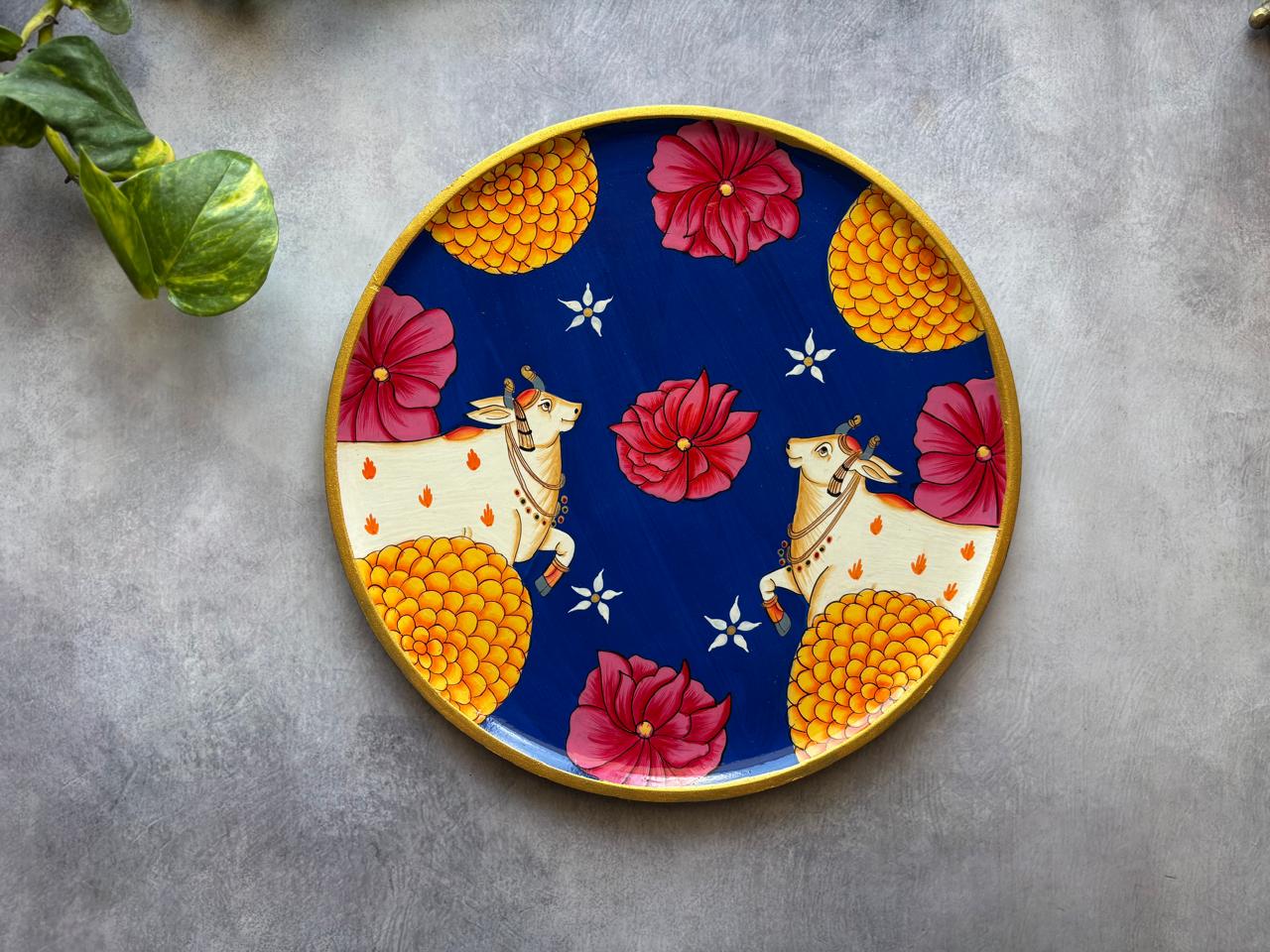 Floral Radiance – Handpainted Pichwai Cow Wallplate (12 Inch MDF Wooden Decor)