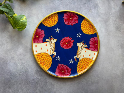 Floral Radiance – Handpainted Pichwai Cow Wallplate (12 Inch MDF Wooden Decor)
